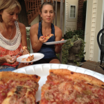 Neely eating pizza